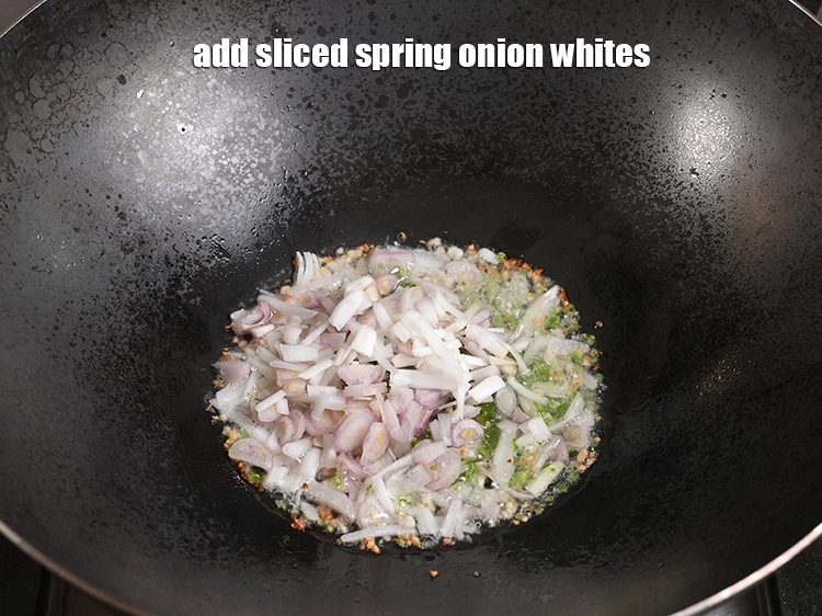 Step 5 – <p>Add ½ cup <a href="https://www.tarladalal.in/glossary-spring-onion-hara-pyaz-443i#ing_2387"><u>sliced spring onions whites</u></a>.</p>