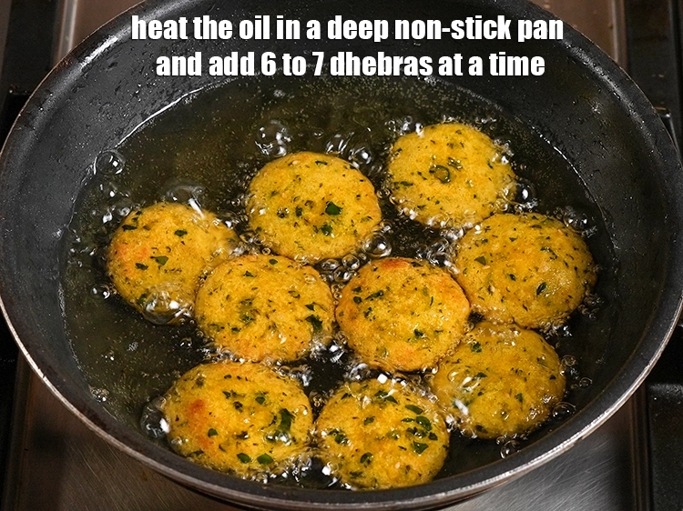 Step 24 – <p>Heat the oil in a deep non-stick pan and add 6 to 7 dhebras at …