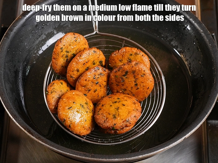 Step 25 – <p>Deep-fry them on a medium low flame till they turn golden brown in colour from …