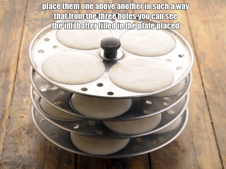 Step 39 – <p>Once all your idli plates are filled and ready, place them one above another in&nbsp;such …