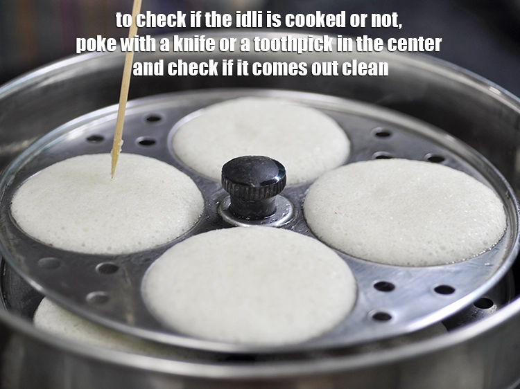 Step 41 – <p>To check if the idli is cooked or not, poke with a knife or a …