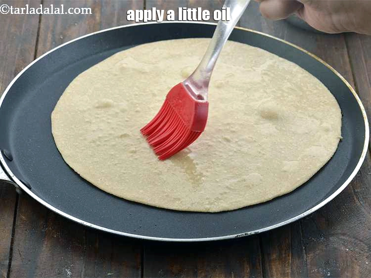 Step 11 – <p><span style="background-color:rgb(255,255,255);color:rgb(0,0,0);">Apply a little oil. Do not apply too much oil or else the roti …
