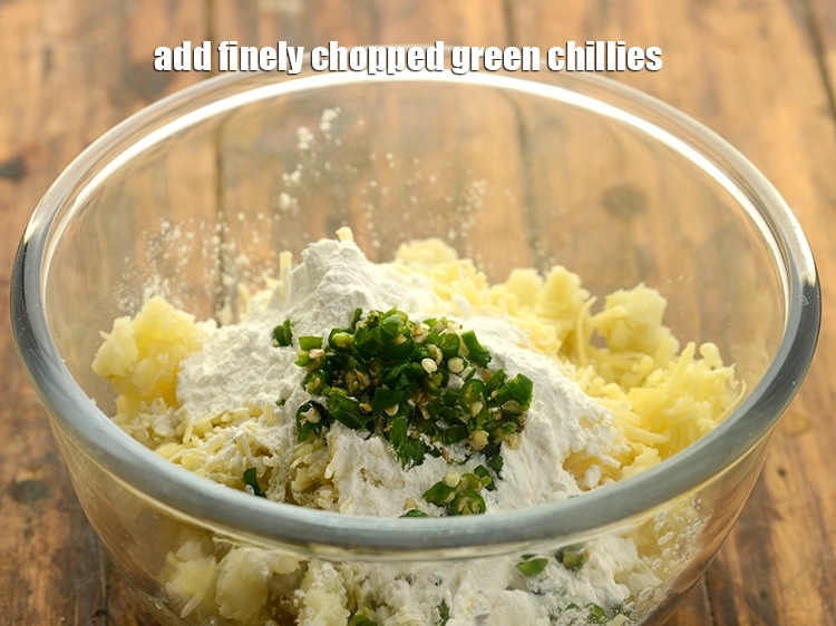 Step 17 – <p>Add finely chopped green chillies. If preparing for kids, add chilli powder or green chilli …