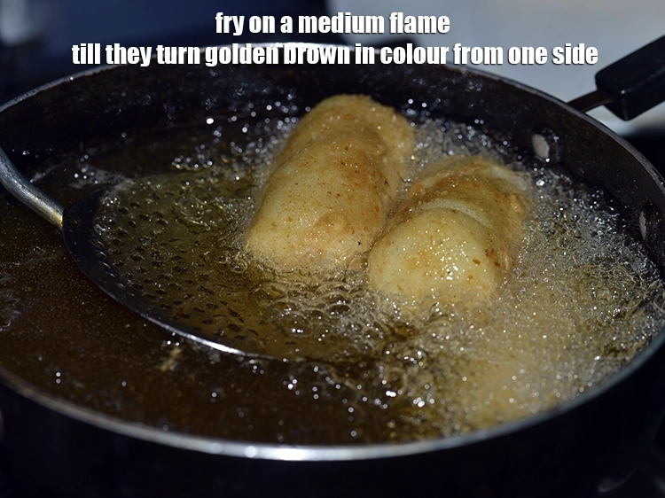 Step 26 – <p><span style="background-color:rgb(255,255,255);color:rgb(0,0,0);">Fry on a medium flame till they turn golden brown in colour from one …