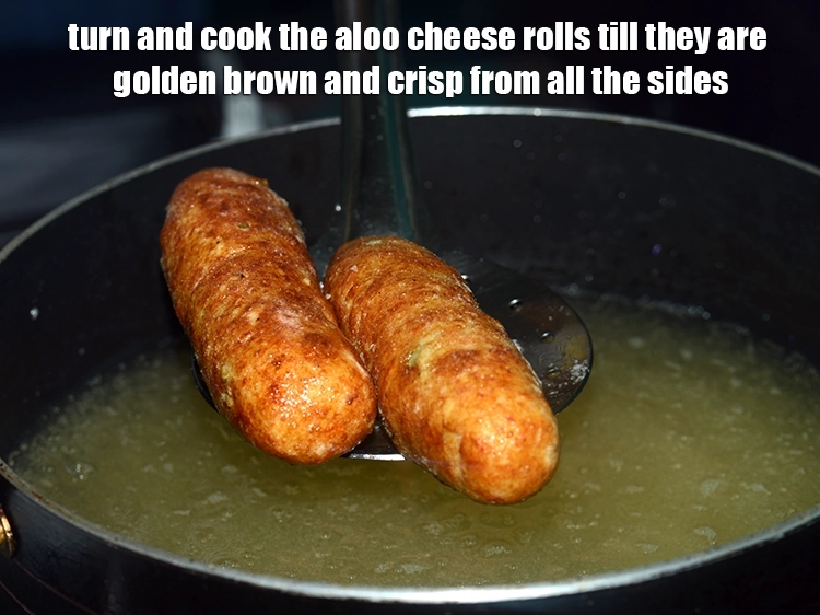 Step 27 – <p><span style="background-color:rgb(255,255,255);color:rgb(0,0,0);">Turn and cook the aloo cheese rolls till they are golden brown and crisp …