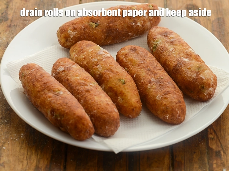 Step 28 – <p><span style="background-color:rgb(255,255,255);color:rgb(0,0,0);">Drain aloo cheese rolls on an absorbent paper and keep aside. Similarly, deep-fry all …