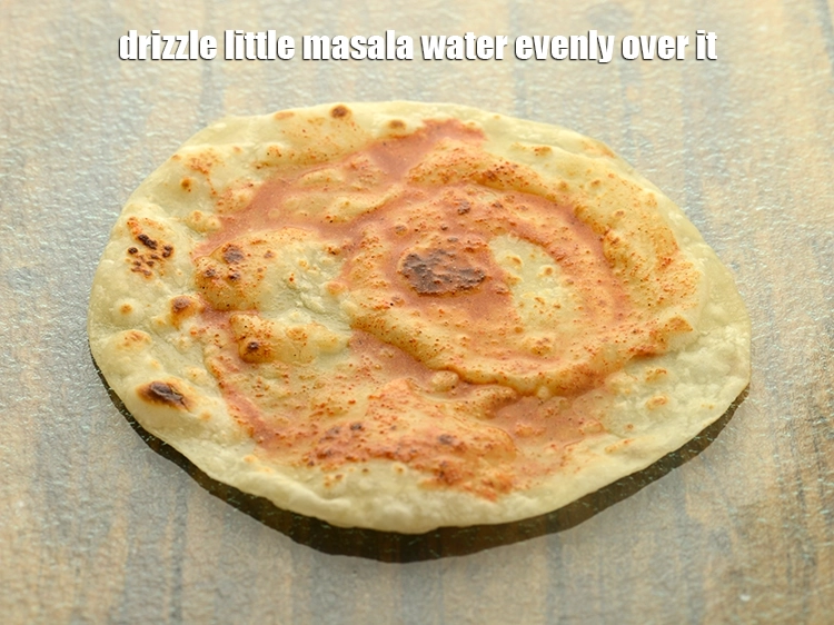 Step 40 – <p>Drizzle little masala water evenly over it.</p>