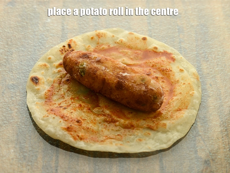 Step 41 – <p>Place a potato roll in the centre.</p>