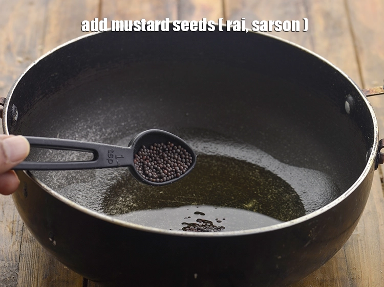 Step 13 – <p>Once the oil is hot, add <span style="background-color:rgb(255,255,255);color:rgb(0,0,0);">1 tsp </span><a href="https://www.tarladalal.com/glossary-mustard-seeds-sarson-rai-sarson-ke-beej-525i"><u>mustard seeds ( rai / …