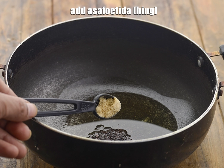Step 14 – <p>Add <span style="background-color:rgb(255,255,255);color:rgb(0,0,0);">1/4 tsp </span><a href="https://www.tarladalal.com/glossary-asafoetida-hing-113i"><u>asafoetida (hing)</u></a><u>.</u></p>