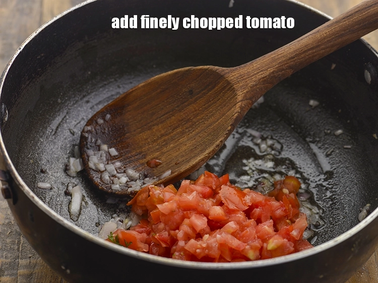 Step 18 – <p>Add the <span style="background-color:rgb(255,255,255);color:rgb(0,0,0);">1/4 cup finely </span><a href="https://www.tarladalal.com/glossary-tomatoes-tamatar-639i#ing_2361"><u>chopped tomato</u></a><u>. &nbsp;</u><span style="background-color:rgb(255,255,255);color:rgb(0,0,0);">Alternatively, you can even use …
