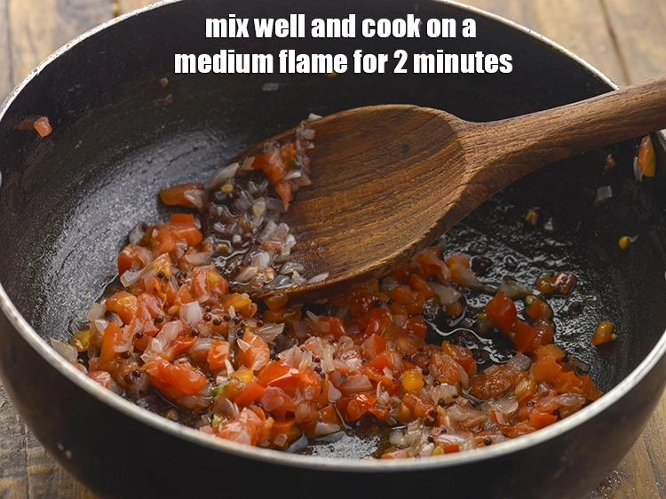 Step 19 – <p><span style="background-color:rgb(255,255,255);color:rgb(0,0,0);">Mix well and cook on a medium flame for 2 minutes, while stirring occasionally.</span></p>