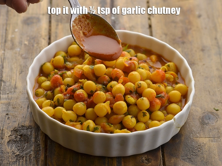 Step 30 – <p>Top it with ½ tsp of <a href="https://www.tarladalal.com/lahsun-ki-chutney-lehsun-chutney-3902r#google_vignette"><strong>garlic chutney</strong></a>.</p>