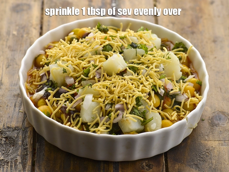 Step 36 – <p>Finally, sprinkle <span style="background-color:rgb(255,255,255);color:rgb(0,0,0);">4 tbsp </span><a href="https://www.tarladalal.com/glossary-sev-1137i"><u>sev</u></a> evenly over&nbsp; <strong>sev usal | Gujarat street food …