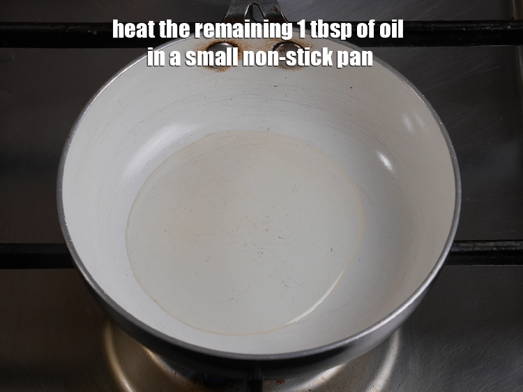 Step 10 – <p>For the suji dhokla tempering, heat the remaining 1 tbsp of <a href="https://www.tarladalal.com/glossary-oil-671i"><u>oil</u></a> in a …