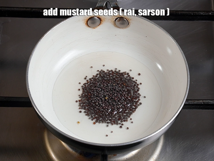 Step 11 – <p>Once the oil is hot, add the <span style="background-color:rgb(255,255,255);color:rgb(0,0,0);">1 tsp </span><a href="https://www.tarladalal.com/glossary-mustard-seeds-sarson-rai-sarson-ke-beej-525i"><u>mustard seeds ( rai …