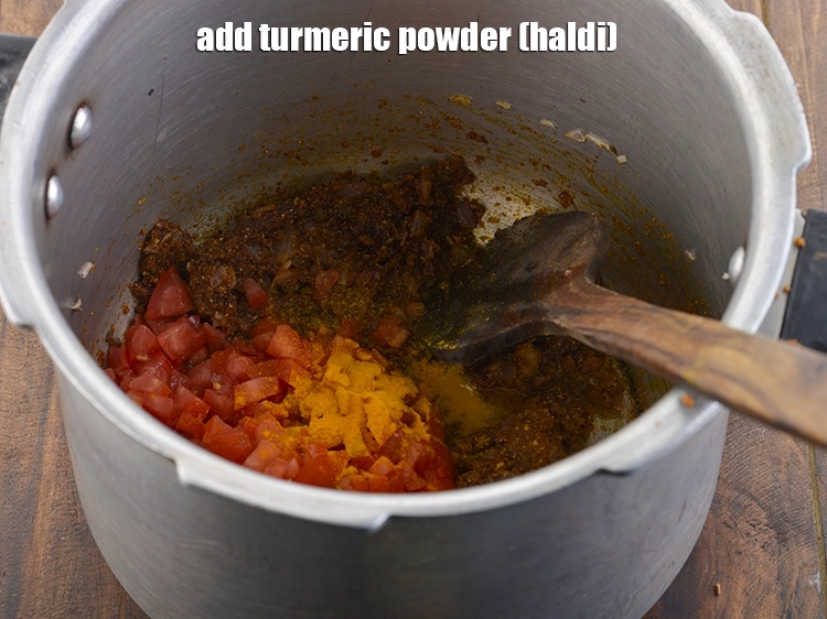 Step 18 – <p>Add the turmeric powder and a little water (approx. 1 tbsp) to prevent the masala …