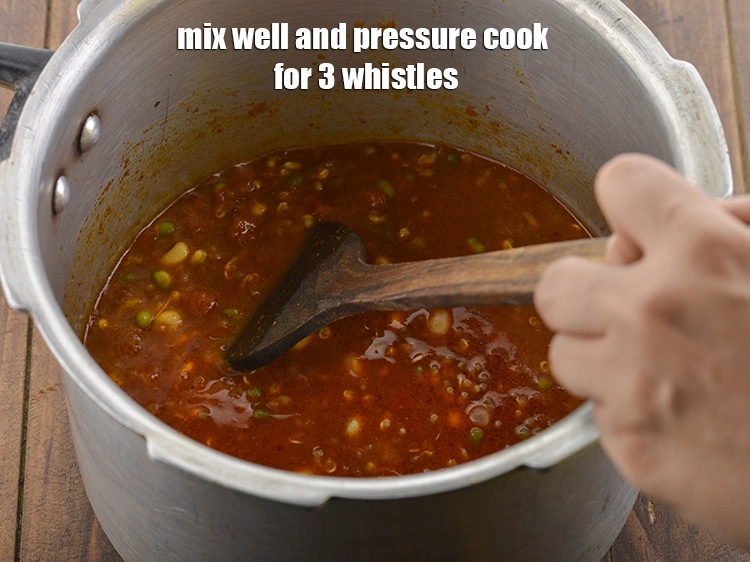 Step 25 – <p>&nbsp;Mix well and pressure cook for 3 whistles.&nbsp;</p>