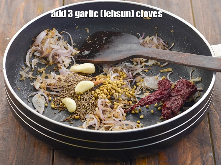 Step 7 – <p>Add the garlic cloves.</p>