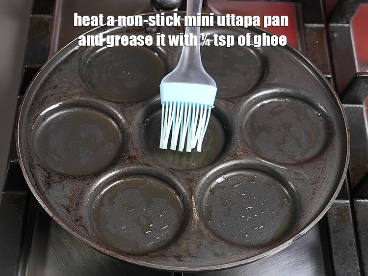 Step 11 – <p>Heat a non-stick mini uttapa pan and grease it with ¼ tsp of ghee.</p>