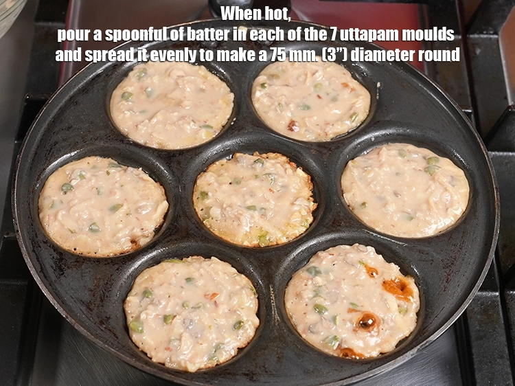 Step 12 – <p>When hot, pour a spoonful of batter in each of the 7 uttapam moulds and …
