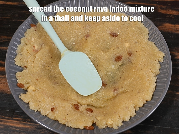 Step 21 – <p><span style="background-color:rgb(255,255,255);color:rgb(0,0,0);">Spread the Coconut Rava Ladoo mixture in a thali and keep aside to cool. …
