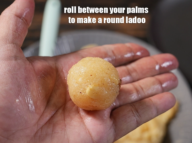 Step 28 – <p><span style="background-color:rgb(255,255,255);color:rgb(0,0,0);">Roll between your palms to make a round ladoo.</span></p>