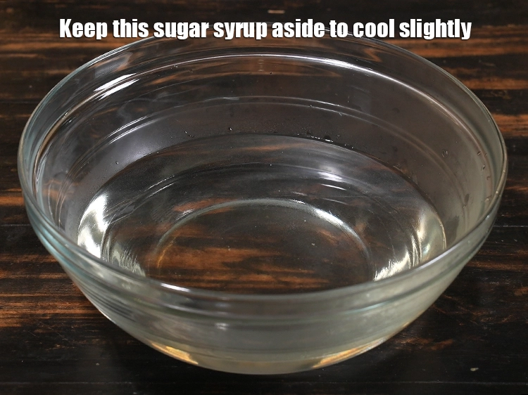 Step 8 – <p><span style="background-color:rgb(255,255,255);color:rgb(0,0,0);">Keep this sugar syrup aside to cool slightly.</span></p>
