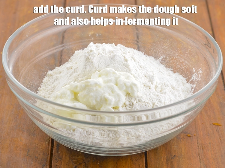 Step 24 – <p>Add the curd. Curd makes the dough soft and also helps in fermenting it.</p>