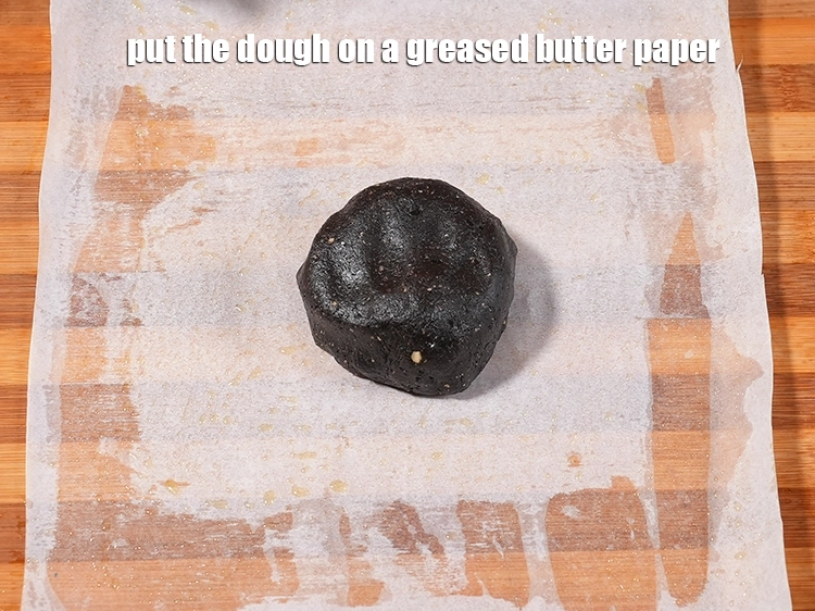Step 11 – <p><span style="background-color:rgb(255,255,255);color:rgb(0,0,0);">Put the dough on a greased butter paper.</span></p>
