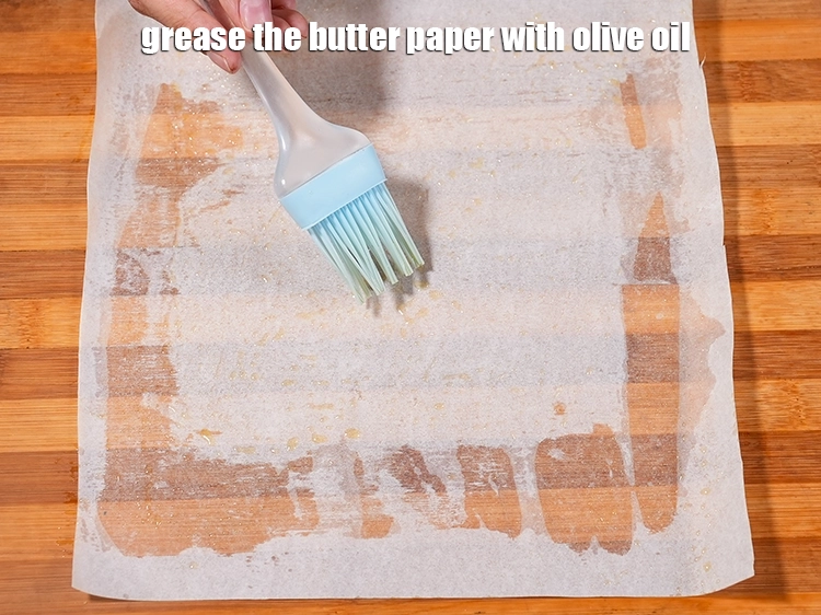 Step 10 – <p>Grease the butter paper with olive oil.</p>