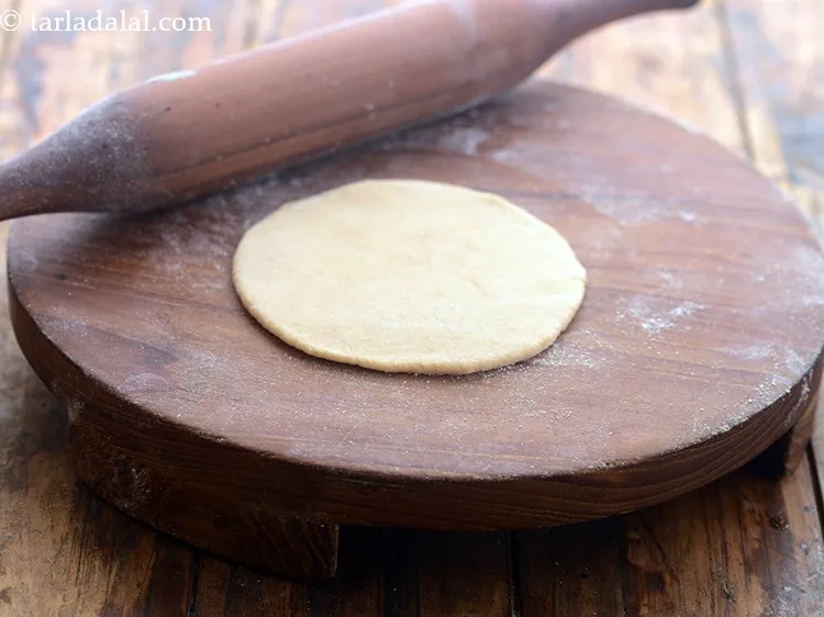 Step 18 – <p>Roll a portion of the dough into a circle of 100 mm. (4”) diameter circle …