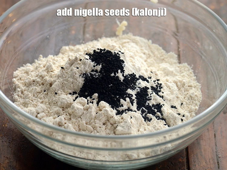 Step 12 – <p>Add <span style="background-color:rgb(255,255,255);color:rgb(0,0,0);">1 tsp </span><a href="https://www.tarladalal.com/glossary-nigella-seeds-kalonji-onion-seeds-552i"><u>nigella seeds (kalonji)</u></a>.</p>