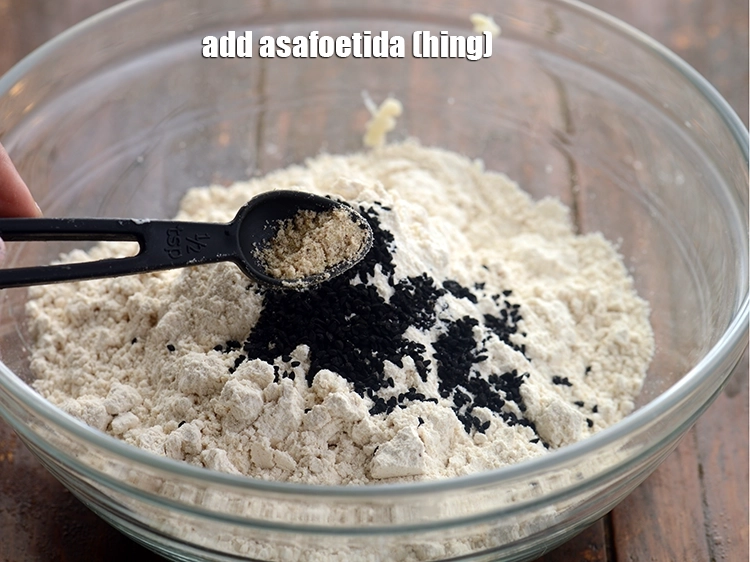 Step 13 – <p>Add <span style="background-color:rgb(255,255,255);color:rgb(0,0,0);">1/4 tsp </span><a href="https://www.tarladalal.com/glossary-asafoetida-hing-113i"><u>asafoetida (hing)</u></a>.</p>