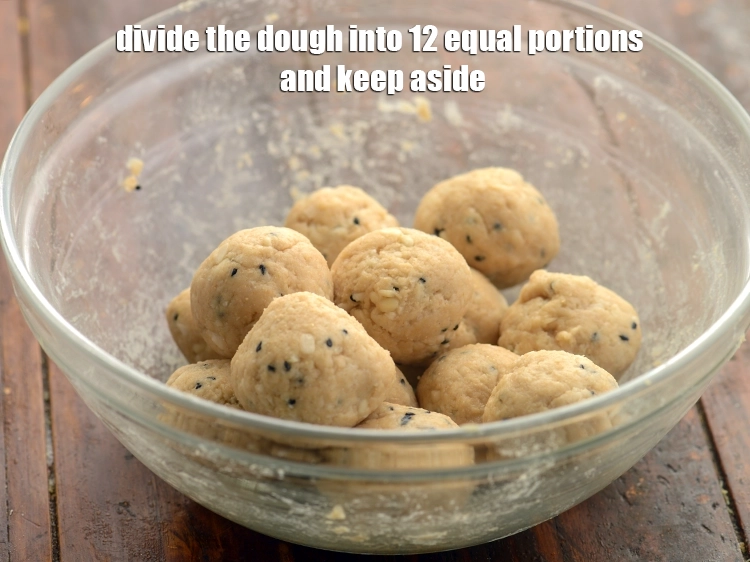 Step 18 – <p>Knead the dough again. Divide the dough into 12 equal portions and keep aside.</p>