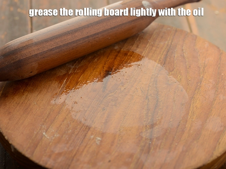 Step 19 – <p>Grease the rolling board lightly with the oil. This will prevent the urad dal ki …