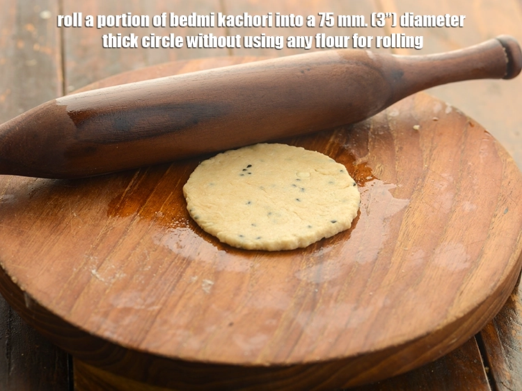 Step 20 – <p>Roll a portion of bedmi kachori into a 75 mm. (3”) diameter thick circle without …