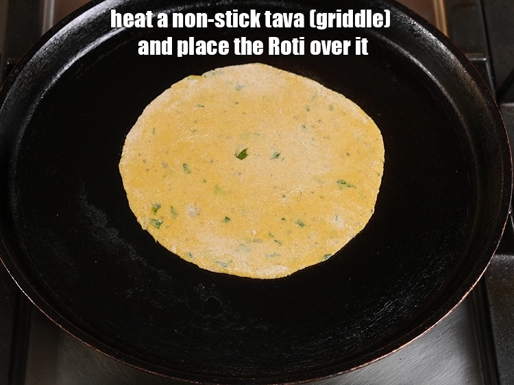 Step 14 – <p><span style="background-color:rgb(255,255,255);color:rgb(0,0,0);">Heat a non-stick tava (griddle) and place the Roti over it.</span></p>