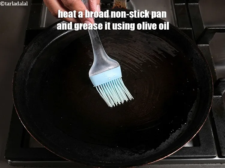 Step 18 – <p>Heat a broad non-stick pan and grease it using 1 tsp olive oil.&nbsp;</p>