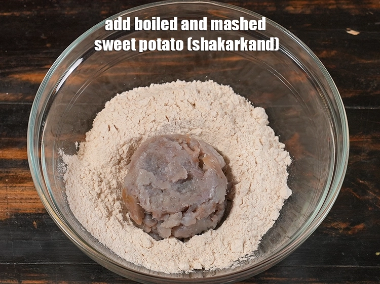 Step 3 – <p>Add 1/2 cup <a href="/glossary-sweet-potato-shakarkand-956i#ing_2609"><u>boiled and mashed sweet potato (shakarkand)</u></a><u>.</u> <span style="color:rgb(0,0,0);">Sweet potato, when boiled …