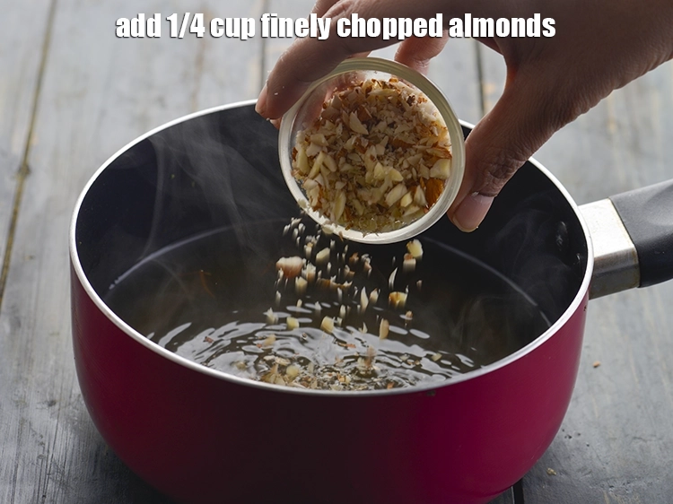 Step 13 – <p>Also, add the <span style="background-color:rgb(255,255,255);color:rgb(0,0,0);">1/4 cup </span><a href="https://www.tarladalal.com/glossary-almonds-badam-378i#ing_3511"><u>finely chopped almonds</u></a><u>.</u></p>