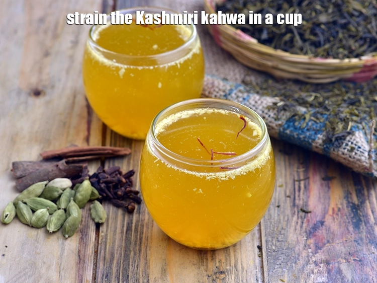 Step 15 – <p>Strain the Kashmiri kahwa in a cup. G<span style="background-color:rgb(255,255,255);color:rgb(0,0,0);">arnished with a few </span><a href="https://www.tarladalal.com/glossary-saffron-kesar-520i"><u>saffron (kesar) …