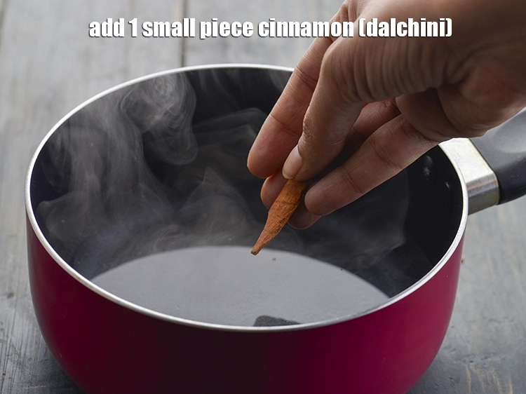 Step 3 – <p>Add the <span style="background-color:rgb(255,255,255);color:rgb(0,0,0);">1 small piece </span><a href="https://www.tarladalal.com/glossary-cinnamon-dalchini-346i"><u>cinnamon (dalchini)</u></a><u>.</u></p>