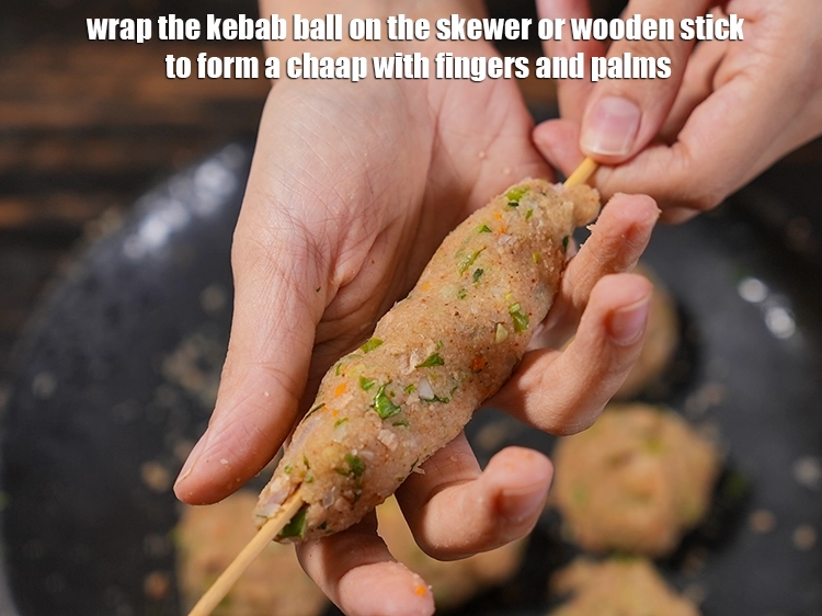 Step 24 – <p><span style="background-color:rgb(255,255,255);color:rgb(34,34,34);">Wrap the kebab ball on the skewer or wooden stick to form a chaap …