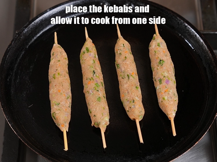 Step 27 – <p><span style="background-color:rgb(255,255,255);color:rgb(34,34,34);">Place the kebabs and allow it to cook from one side.</span></p>