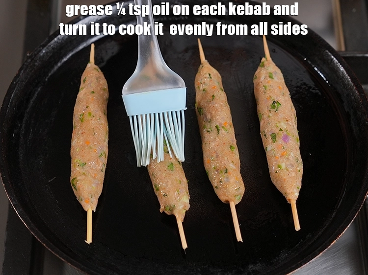 Step 28 – <p><span style="background-color:rgb(255,255,255);color:rgb(34,34,34);">Grease ¼ tsp oil on each kebab and turn it to cook it&nbsp; evenly …