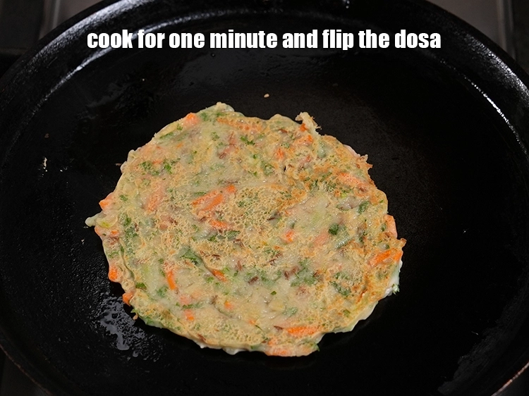 Step 16 – <p><span style="background-color:rgb(255,255,255);color:rgb(34,34,34);">Cook for one minute and flip the dosa.</span></p>