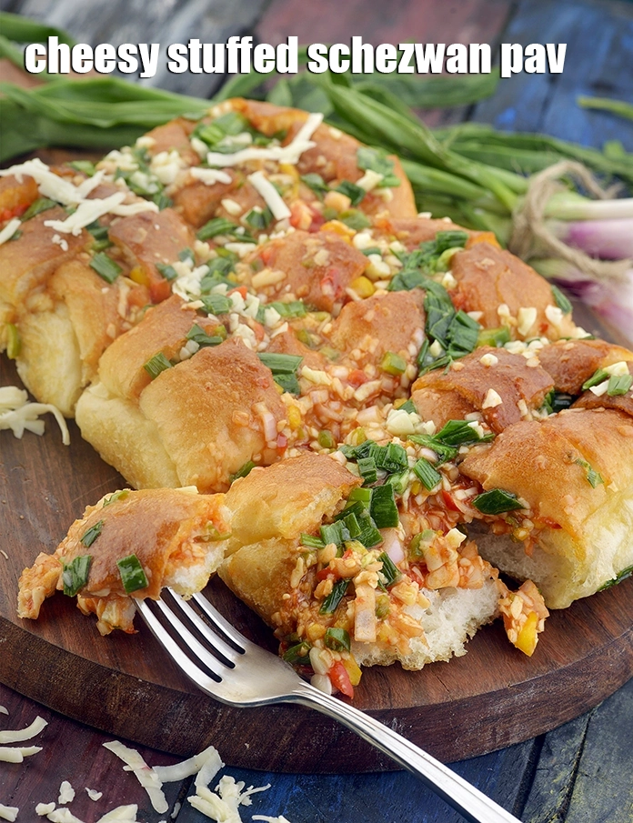 Step 31 – <p><span style="background-color:rgb(255,255,255);color:rgb(0,0,0);">Serve <strong>stuffed cheesy schezuan</strong> pav immediately.&nbsp;</span><a href="https://www.tarladalal.com/cheesy-bread-fingers-33980r"><u>Cheesy Bread Fingers</u></a><span style="background-color:rgb(255,255,255);color:rgb(0,0,0);">, </span><a href="https://www.tarladalal.com/stuffed-cheesy-garlic-bread-41570r"><u>Stuffed Cheesy Garlic …