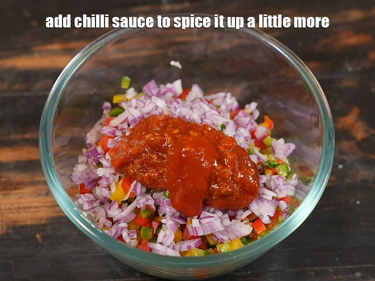 Step 7 – <p>Add chilli sauce to spice it up a little more.</p>