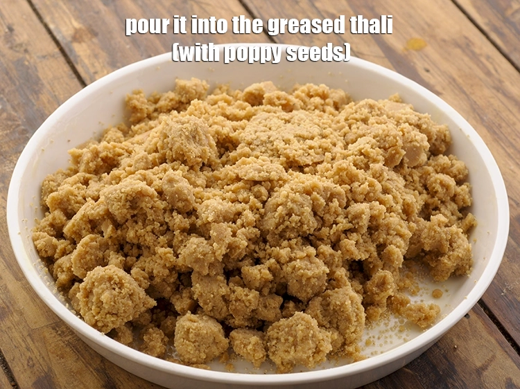 Step 12 – <p>When the jaggery melts and the mixture is still warm, pour it into the greased …
